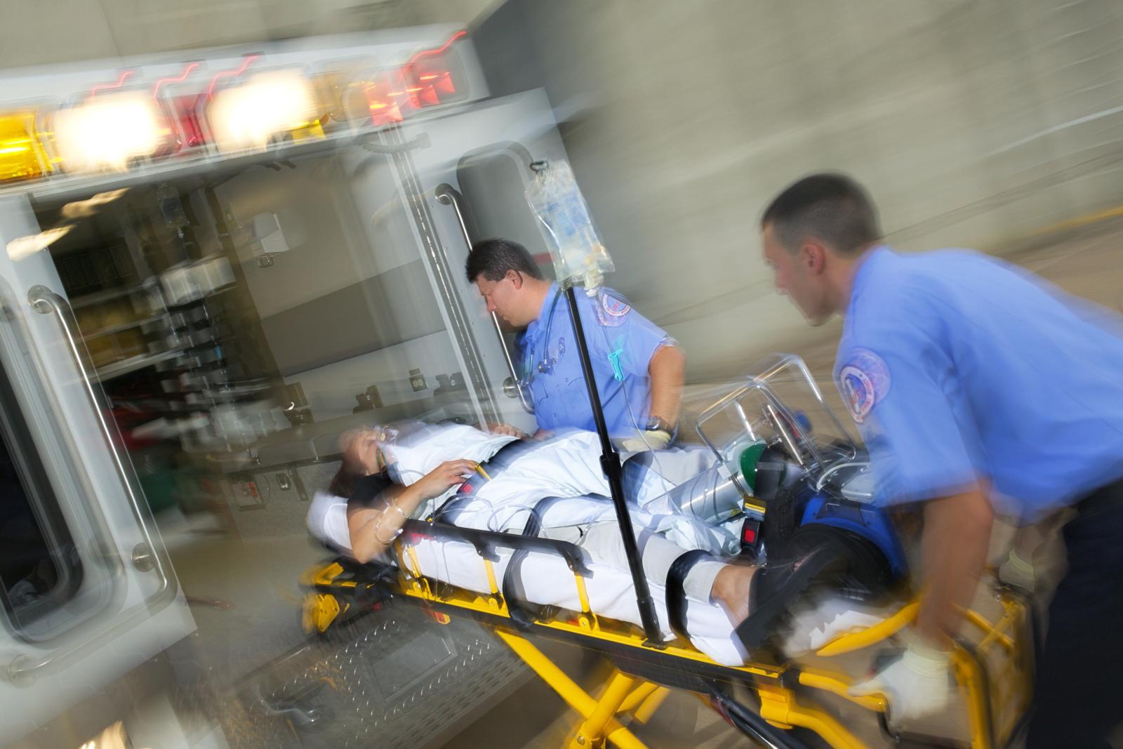 Paramedics transporting a patient hurriedly